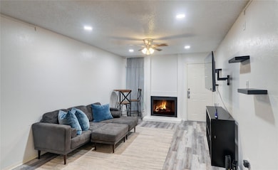 LIVING ROOM WITH WOOD-BURNING FIREPLACE