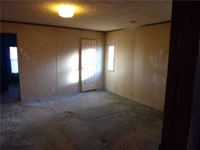 Master bedroom needs carpet and paint.  Walk-in closet.