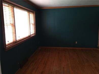Formal living room with a  hardwood floor and crow