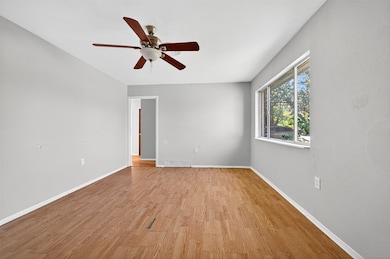 Spare room featuring light wood-type flooring and ceiling fan