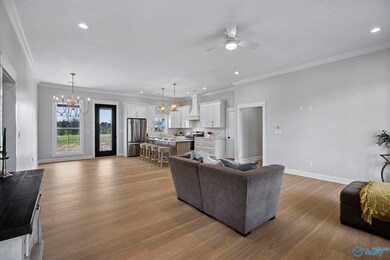Spacious foyer is greeted by cozy Family room that flows to Kitchen & Dining Room