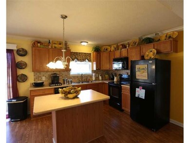 Kitchen. The kitchen features plenty of cabinet space and a center island .