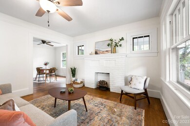 Living Room Leads to Dining and Kitchen