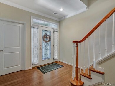 Bright foyer with lovely etched glass front door