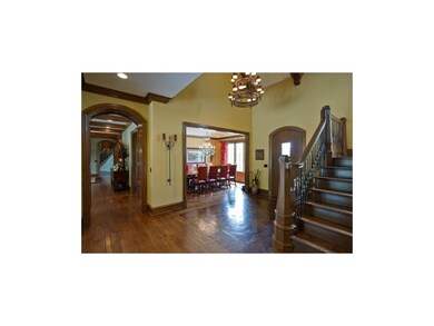 Beautiful archways lead you to the kitchen and uti