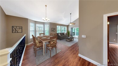 Open floor plan, dining to living area, open to ki