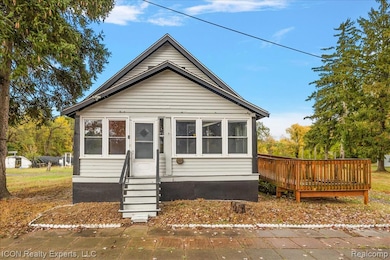 View of front of house with a sunroom and entry steps