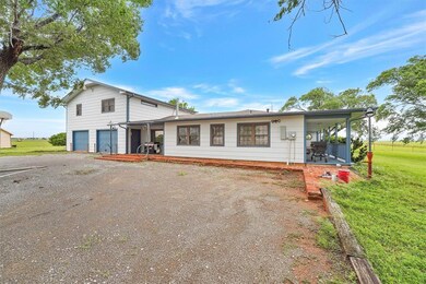 Side of home and driveway.