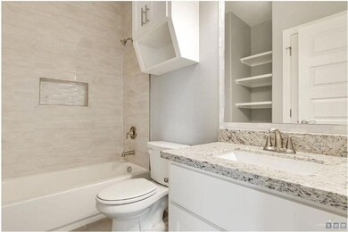 Bathroom featuring vanity and shower / tub combination