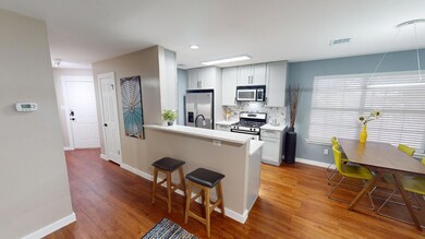 Kitchen featuring stainless steel appliances, a b