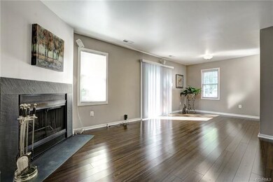 The spacious great room is enhanced by a wood burn