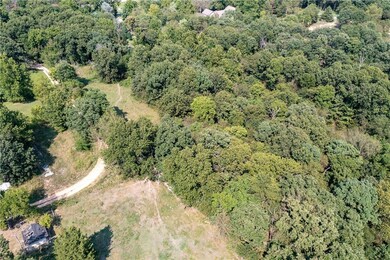 Property is South and East of this road. Well hous