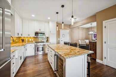 Striking granite countertops from Africa  with a mix of cream, gold, gray, and brown tones, adding natural texture and warmth.