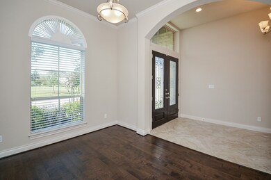 The sophisticated light/dark theme is seen throughout. This 'flex' room, with its huge arched window, can become anything you want it to be; perhaps a study/home office?
