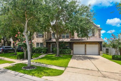 This is a charming two-story brick home with a dou