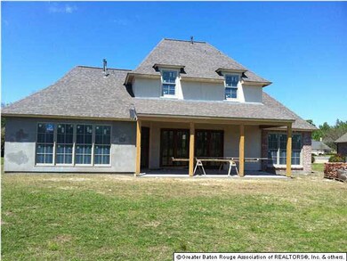 Rear design takes full advantage of golf course view, including keeping area (lower left), living area, and master bedroom. Spacious rear porch faces east, making this area extra-enjoyable in the summertime.