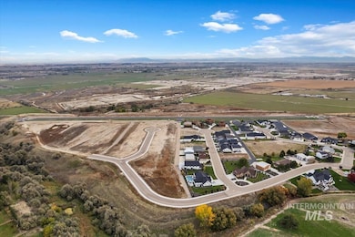 Aerial overview of property's location with nearby suburban area and a mountain backdrop