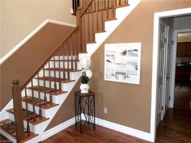 Two story foyer with turn staircase.