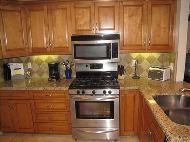 Granite kitchen counters and wood grade cabinets