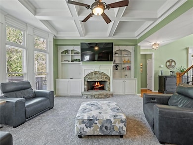 Bright Family room w/coffered ceiling, bookcases, 