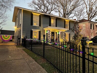 Featuring the gated front yard & driveway