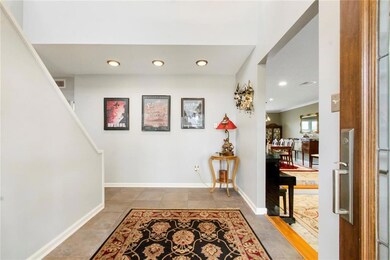 The two story foyer is bright and airy.