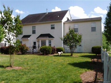 Nice backyard with lots of flowering trees and shr