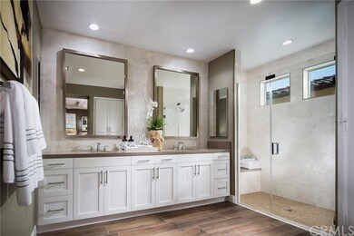 Large walk-in shower and dual sinks pefect this ma