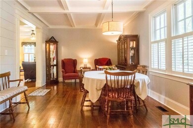 Large dining room with coffered ceiling.
