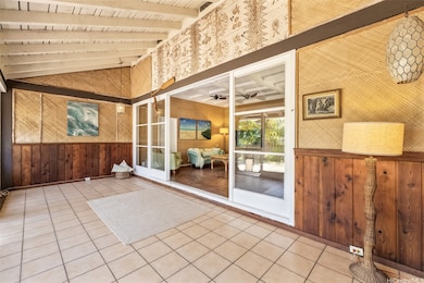 An enclosed, screened-in front porch makes a great