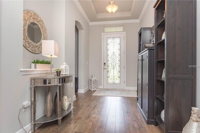 Grand foyer with wood floorings, double trey ceili