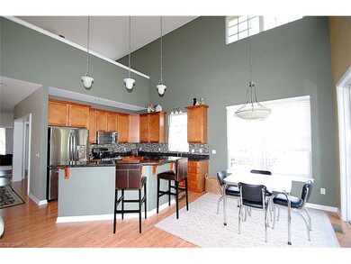Eat-in kitchen with cathedral ceiling and sliders 