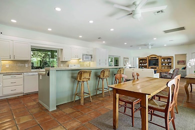 Enormous kitchen with tons of counterspace eat in kitchen or at bar. Great flow for entertaining your family and friends.
