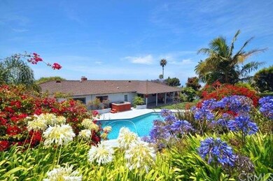 Lushly Landscaped Backyard with Pool and Hot Tub