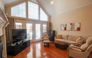 Living area with high vaulted ceiling, wood finish