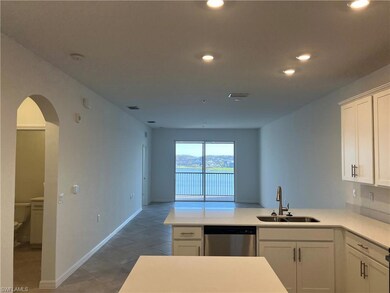 Kitchen with light countertops, stainless steel di