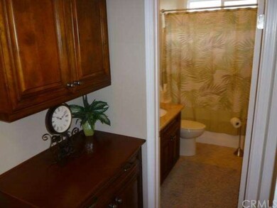 Linen cabinet outside guest bathroom.