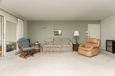 Shot of living room from dining room.  Entry door 