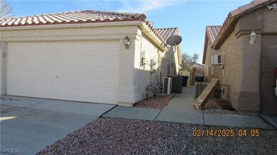View of side of property with central AC unit, con