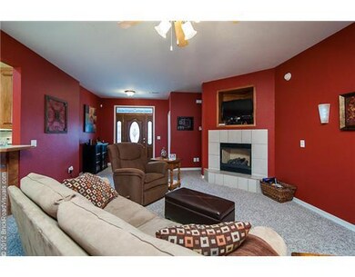 Living Room. Spacious Living Room has gas log fireplace with beautiful tile surround and hearth.