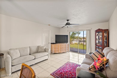 Living room featuring light tile patterned floorin