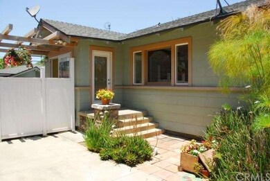 Side view of house with side entrance next to driv