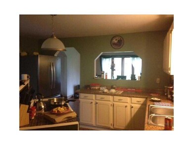 Cozy kitchen facing the dining room.