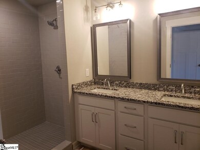 Full tile shower with door and seat, granite vanit