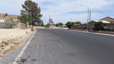 View of street featuring street lighting, traffic