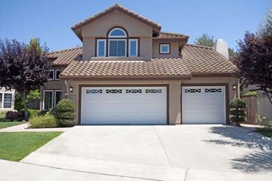 Oversized 3 car garage and full driveway