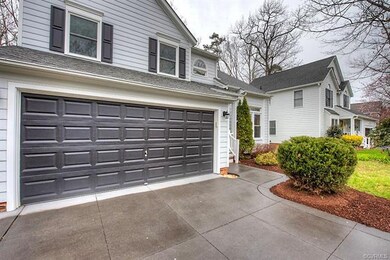 Two Car Garage with Paved Driveway