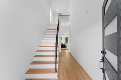 Step inside and note the gorgeous engineered wood