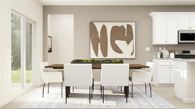 Dining space with light wood-style flooring