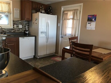 The kitchen offers outdoor access to the covered s